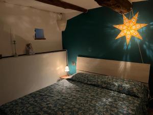 a bedroom with a bed with a star on the wall at Under The Tuscan Sun in Monterotondo