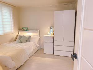 Postel nebo postele na pokoji v ubytování Rapym Coliving House