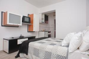 Kuchyň nebo kuchyňský kout v ubytování Apartments Gold