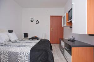 Postel nebo postele na pokoji v ubytování Apartments Gold