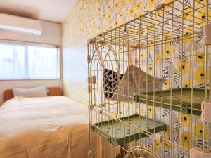 Postel nebo postele na pokoji v ubytování タイピーハウス