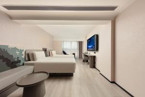 TV o dispositivi per l'intrattenimento presso Atour Light Hotel Xiamen Convention and Exhibition Center Software Park Phase II