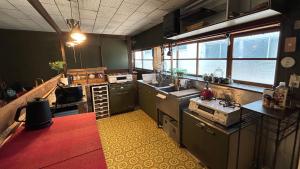 a kitchen with a sink and a counter top at nano inn in Kanagawa