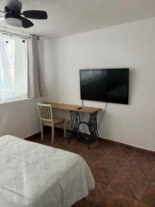 Μια τηλεόραση ή/και κέντρο ψυχαγωγίας στο Confortable depa cerca de Expo Guadalajara