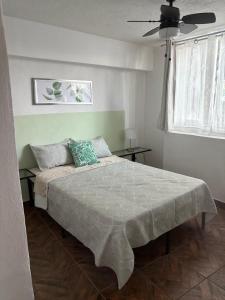 Ένα ή περισσότερα κρεβάτια σε δωμάτιο στο Confortable depa cerca de Expo Guadalajara