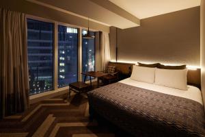 Voodi või voodid majutusasutuse SHIBUYA STREAM HOTEL formerly Shibuya Stream Excel Hotel Tokyu toas