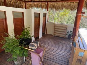 Balkón nebo terasa v ubytování Itsalifestyle Jungle Cabana