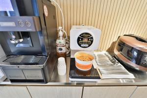 Kuchyň nebo kuchyňský kout v ubytování Ulsan Samsan CUSTOM HOTEL