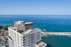 an aerial view of a building near the water at Gangneung The Gangneung Ocean Stay Part4 in Gangneung