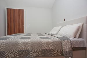 Postel nebo postele na pokoji v ubytování Apartments Gold