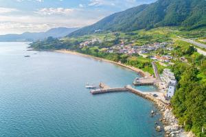 an aerial view of a beach in a body of water at Yeosu Yellow Sub Marine in Yeosu +3 photos