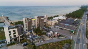 an aerial view of a city next to the ocean at Gangneung Travel Good Camping Pension in Gangneung