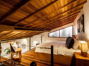 Ένα ή περισσότερα κρεβάτια σε δωμάτιο στο Bisma Apartment Canggu