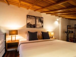 Ένα ή περισσότερα κρεβάτια σε δωμάτιο στο Bisma Apartment Canggu