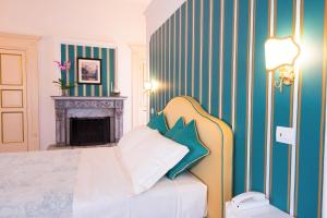 Postel nebo postele na pokoji v ubytování B&B Maiurè