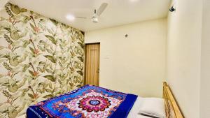 Un pat sau paturi într-o cameră la Moonland 3 Bhk villa