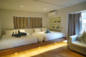 Postel nebo postele na pokoji v ubytování Softlight Inn Asakusa Tokyo