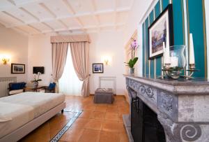Postel nebo postele na pokoji v ubytování B&B Maiurè
