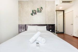 Ένα ή περισσότερα κρεβάτια σε δωμάτιο στο ICity 2Bedroom Lux Apartment