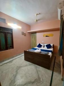 Postel nebo postele na pokoji v ubytování Ratna's Nest Homestay + 1 fotografie