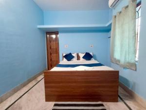 Postel nebo postele na pokoji v ubytování Ratna's Nest Homestay