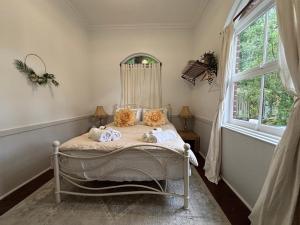 Katil atau katil-katil dalam bilik di Celestial Dew Guesthouse in Tyalgum