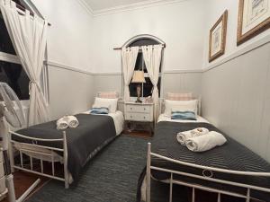 Postel nebo postele na pokoji v ubytování Celestial Dew Guesthouse in Tyalgum