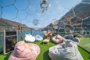 a soccer goal with four bean bags on a field at Gapyeong Petite Dog Pension in Gapyeong