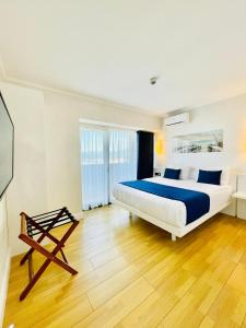 a bedroom with a king sized bed and a television at Luxury View Hotel in Batumi