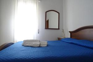 Postel nebo postele na pokoji v ubytování Casa Indipendente I DUE MARI