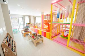 a room with a play room with a play structure at THE NAVY HOUSE HOTEL in Sattahip