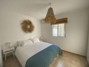 a bedroom with a bed and a window at Terreta de Denia in Denia +57 photos