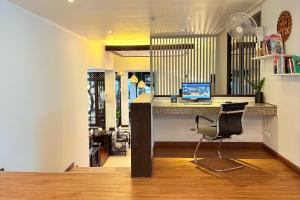 a office with a desk with a laptop on it at Days Inn by Wyndham Patong Beach in Patong Beach
