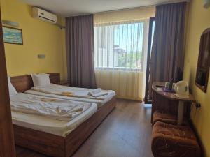 Postel nebo postele na pokoji v ubytování Vladimirov Guest House