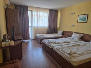 Postel nebo postele na pokoji v ubytování Vladimirov Guest House
