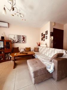 a living room with a couch and a table at Katerina Apartment in Kavala