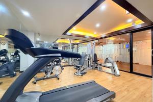 a gym with several treadmills and cardio machines at Days Inn by Wyndham Patong Beach in Patong Beach