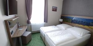 Krevet ili kreveti u jedinici u okviru objekta Hotel Alte Brennerei