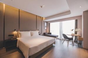 Postel nebo postele na pokoji v ubytování Atour S Hotel Shanghai Xujiahui Tianyaoqiao + 27 fotografií