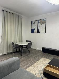 a living room with a table and chairs at SmartFix Luxury Properties in Lagos