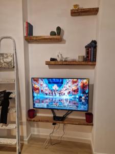 a television sitting on a shelf in a room at Mammì in Balestrate