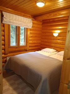 Postel nebo postele na pokoji v ubytování Kolilla oy, Purnutar B + 16 fotografií