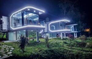 a house with lights on the side of it at Cápsulas San Vicente in Mazamitla +1 photo