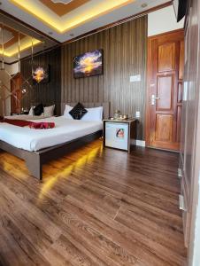 Postel nebo postele na pokoji v ubytování HA Hotel & Apartment