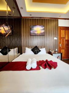 Postel nebo postele na pokoji v ubytování HA Hotel & Apartment