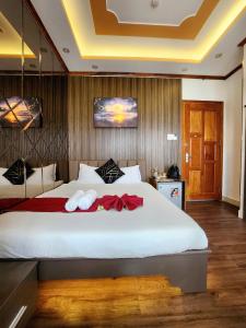 Postel nebo postele na pokoji v ubytování HA Hotel & Apartment