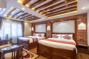 Rúm í herbergi á Amarawati Boutique Hotel