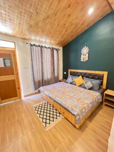 a bedroom with a large bed in a room at The Dreamcatcher room’s & cafe in Kasol +53 photos