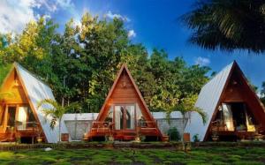 a small house with two pointed roofs at Aikoli Kang Resort in Miafeng