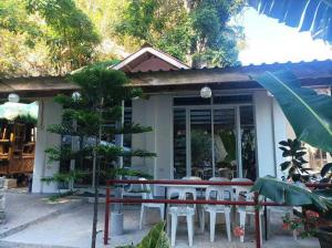 a table and chairs in front of a building at E - House VILLA Kristina in Lobo +7 photos